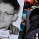 Demonstrators hold placards featuring an image of former U.S. intelligence contractor Edward Snowden as they take part in a protest the NSA’s surveillance in Germany on July 27, 2013.